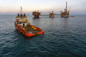 A tug boat performing anchor handling task at oil field