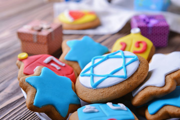 Fototapeta na wymiar Plate with tasty glazed cookies for Hanukkah, closeup