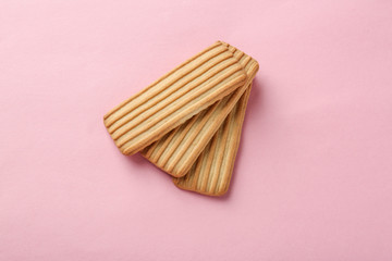 Baby cookies on pink background