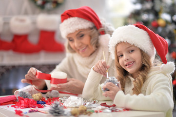 Grandmother and child preparing for Christmas
