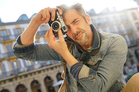 Photographer in Spain taking pictures with vintage camera