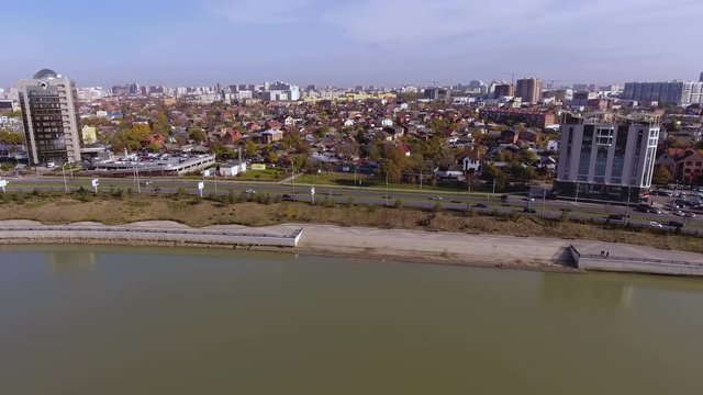 Aerial shot of the russian south city - Krasnodar. The river Kuban. 4K