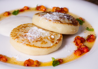Soft, delicate cheesecake with sea buckthorn sauce