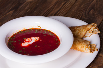Russian soup and pancakes with sour cream