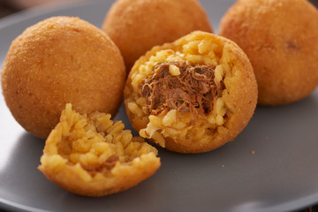 Arancini (deep fried rice balls with meat) Typical Sicilian street food