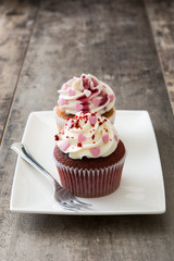 Valentine cupcakes decorated with sweet hearts on wooden table
