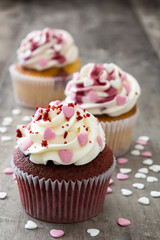Valentine cupcakes decorated with sweet hearts on wooden table
