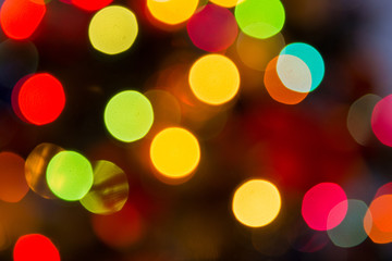 Lights blurred bokeh background from christmas night party for your design, vintage or retro color toned