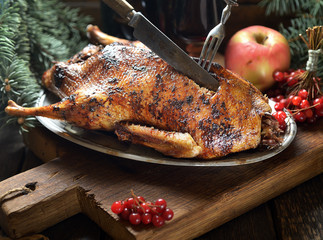 grilled duck with apples on a plate. rustic style