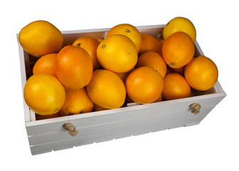 Ripe oranges in a white wooden box, on white background, isolated