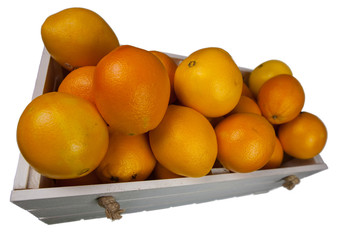 Ripe oranges in a white wooden box, on white background, isolated