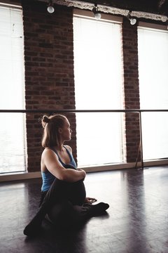 Woman performing stretching exercise