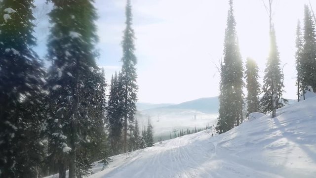 Gorgeous mountains in Sheregesh covered with snow, and beautiful snowy woods under bright winter sun in slow motion. 1920x1080