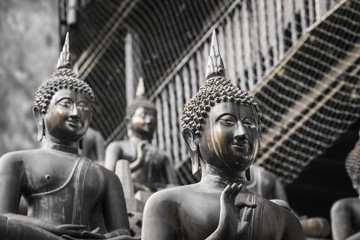 Row of Buddha statues at Ganagarama temple, Colombo, Sri Lanka.
