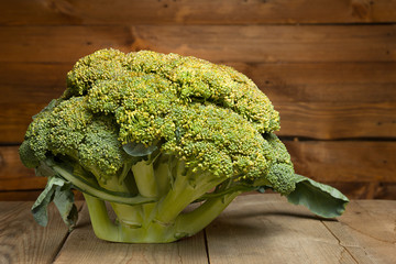 Fresh healthy useful broccoli vegetable on wooden table close up