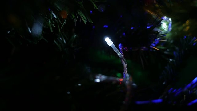 Dot LED lights blinking at night shallow DOF 4K 2160p 30fps UltraHD footage - Christmas tree decorative colorful bulbs close-up 3840X2160 UHD video 