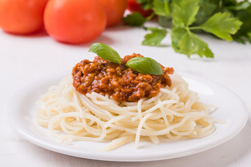 spaghetti bolognese on white table