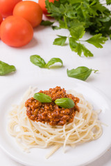 spaghetti bolognese on white table
