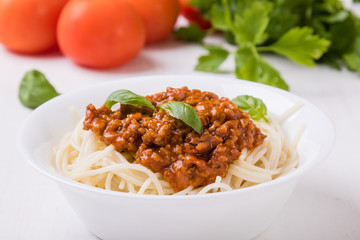 spaghetti bolognese on white table