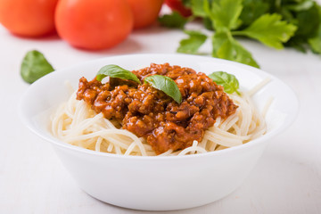 spaghetti bolognese on white table