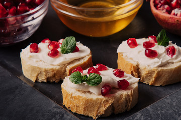 bread with cream cheese and pomegranate