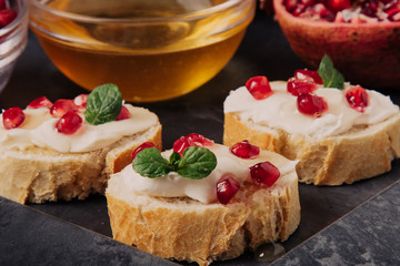 bread with cream cheese and pomegranate