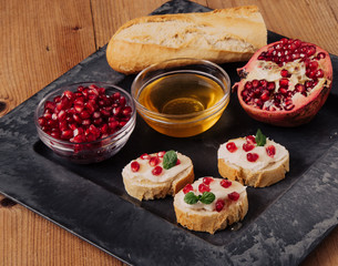 bread with cream cheese and pomegranate