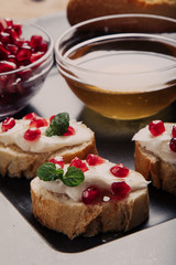 bread with cream cheese and pomegranate