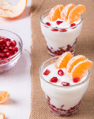 yogurt with pomegranate seeds and mandarin orange