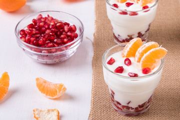 yogurt with pomegranate seeds and mandarin orange