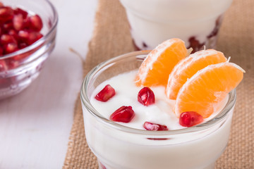 yogurt with pomegranate seeds and mandarin orange