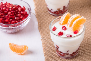 yogurt with pomegranate seeds and mandarin orange