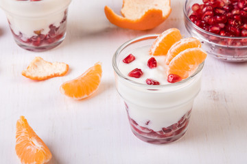 yogurt with pomegranate seeds and mandarin orange