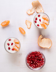 yogurt with pomegranate seeds and mandarin orange