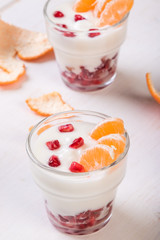 yogurt with pomegranate seeds and mandarin orange