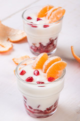 yogurt with pomegranate seeds and mandarin orange
