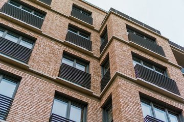 modern brick apartment house with big windows