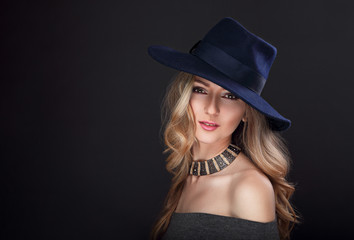 Glamour sexy makeup blond long hair woman posing in fashion hat