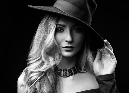 Sexy makeup blond long hair style woman posing in fashion hat an