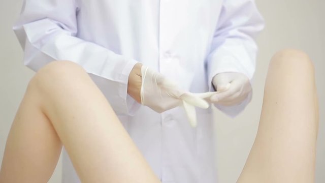 Doctor gynecologist performing an examination