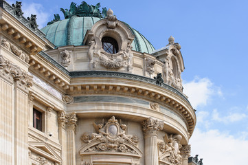 Fototapeta na wymiar Detail of the facade and roof of the Paris National Opera (present name - The National Academy of Music and Dance), built in 1875.
