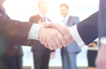 Concept of partnership - handshake  business partners