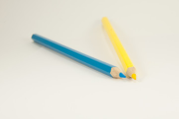 two pencils yellow and blue