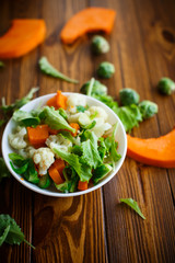 salad of lettuce, cauliflower and Brussels sprouts with a pumpkin