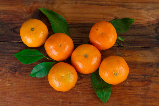 tangerines organic fruit top view over wooden background