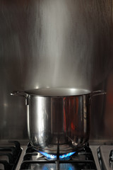 Steel pot boiling on fire