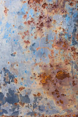 Fototapeta premium Blue peeling paint and rusty old metal background, texture. Vertical.