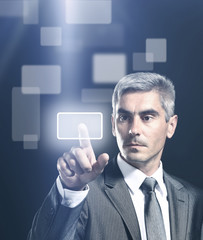 business man pressing a virtual button