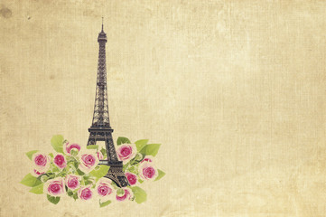 Eifel tower isolated over fabric background with blooming rose flowers. Eiffel Tower from Champ de Mars, Paris, France.
