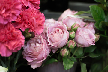 Spring Flowers in a flower shop. Street flower market. Different roses.